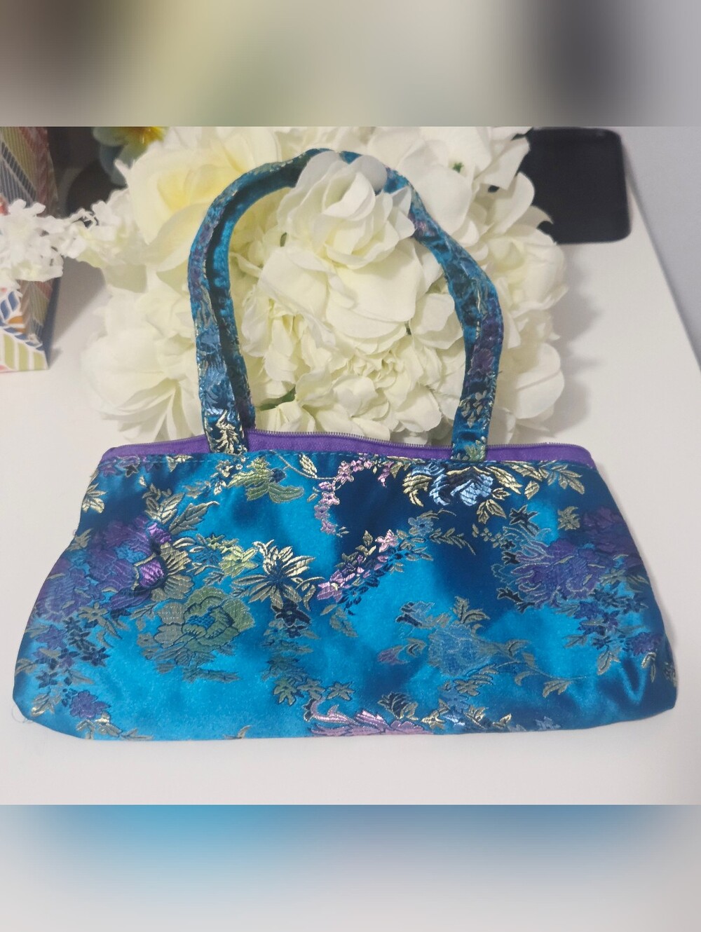 Oriental-style handbag crafted from Chinese brocade satin.